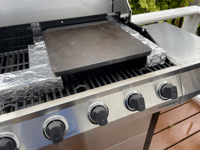 A pizza oven built onto a gas grill