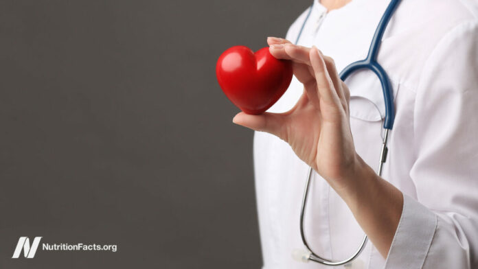 doctor holding a heart-shaped ornament